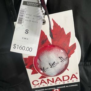 Insulated black vest with fabulous fur trimmed hood.